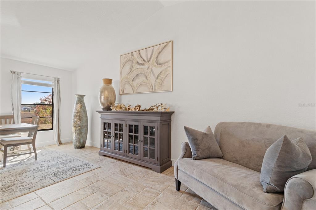 488 Fieldstone Lane Spring Hill, FL 34606 - Photo 21 of 55 a living room with furniture and a window