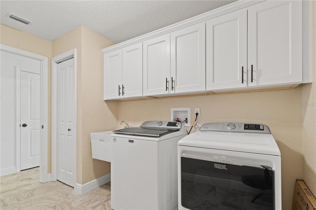 488 Fieldstone Lane Spring Hill, FL 34606 - Photo 23 of 55 a utility room with dryer and washer