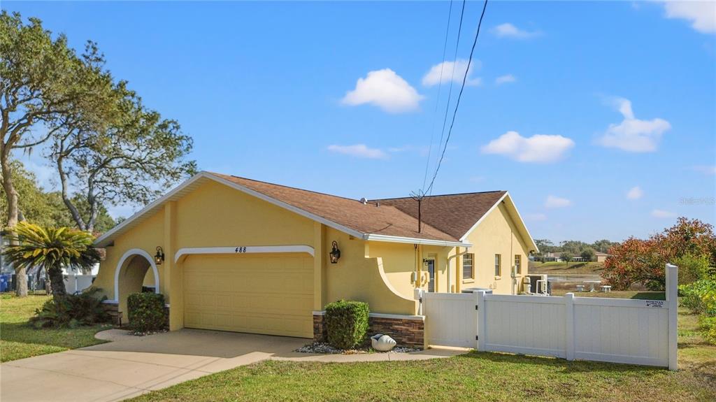 488 Fieldstone Lane Spring Hill, FL 34606 - Photo 3 of 55 a view of a house with a yard