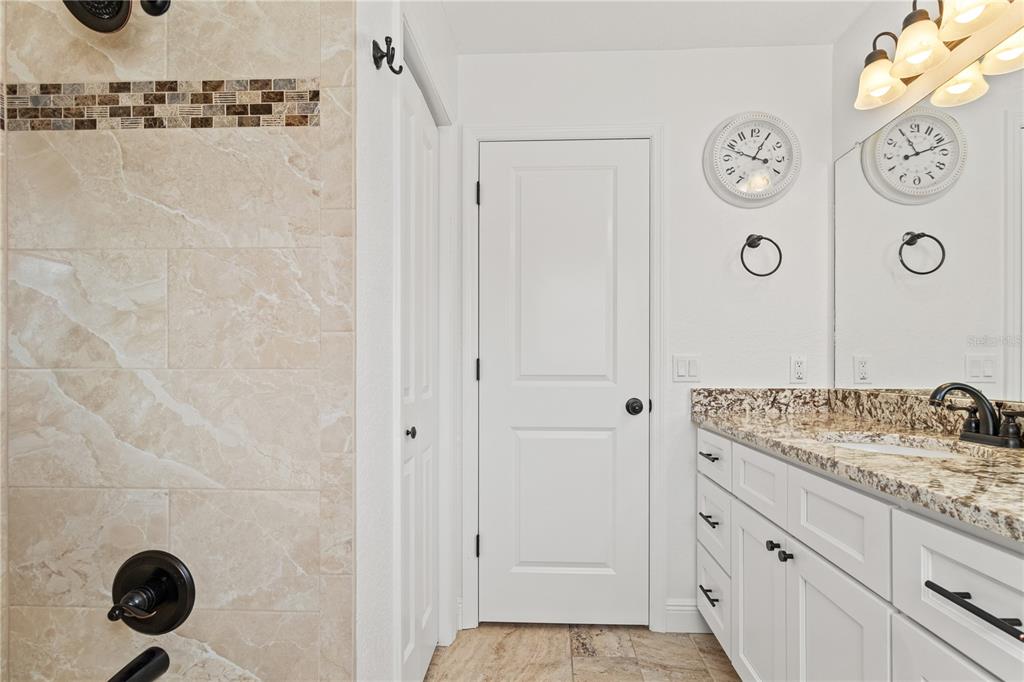 488 Fieldstone Lane Spring Hill, FL 34606 - Photo 32 of 55 a bathroom with a shower and mirror