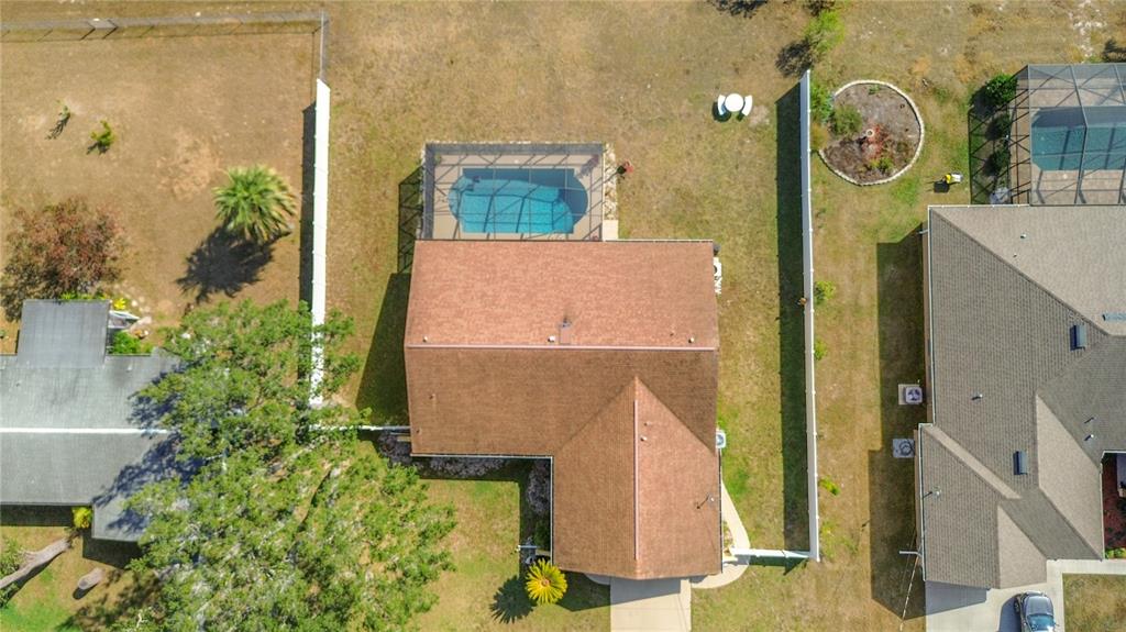 488 Fieldstone Lane Spring Hill, FL 34606 - Photo 45 of 55 swimming pool view with sitting space and garden view