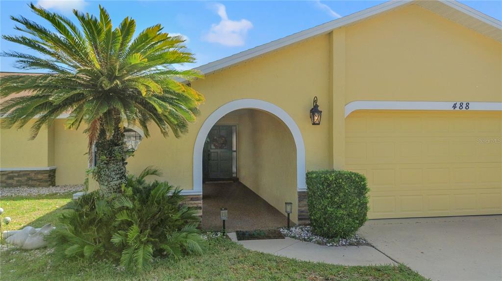 488 Fieldstone Lane Spring Hill, FL 34606 - Photo 53 of 55 a view of a garden with palm trees