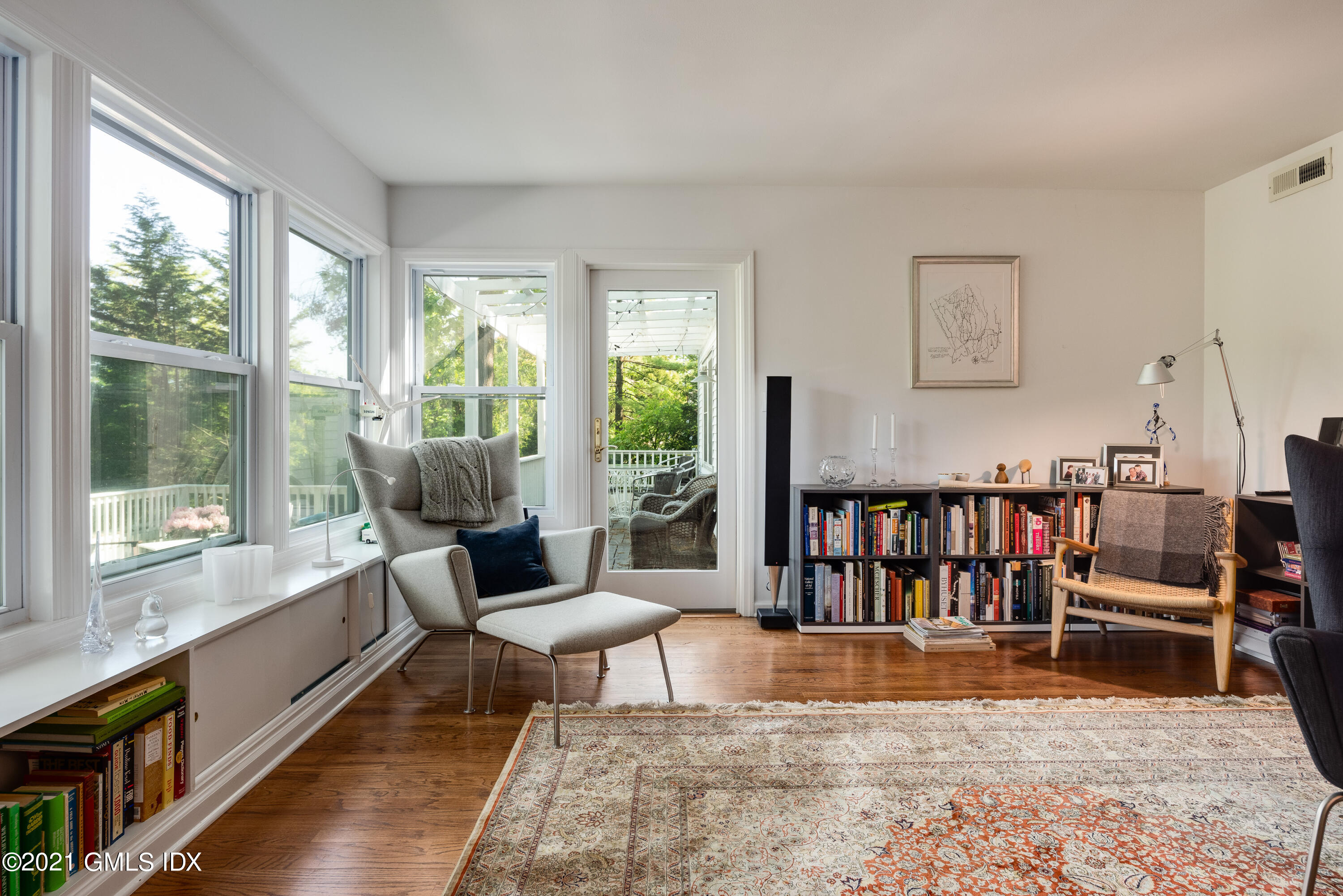 90 Oneida Drive Greenwich, CT 06830 - Photo 12 of 30 a living room with furniture large window and wooden floor