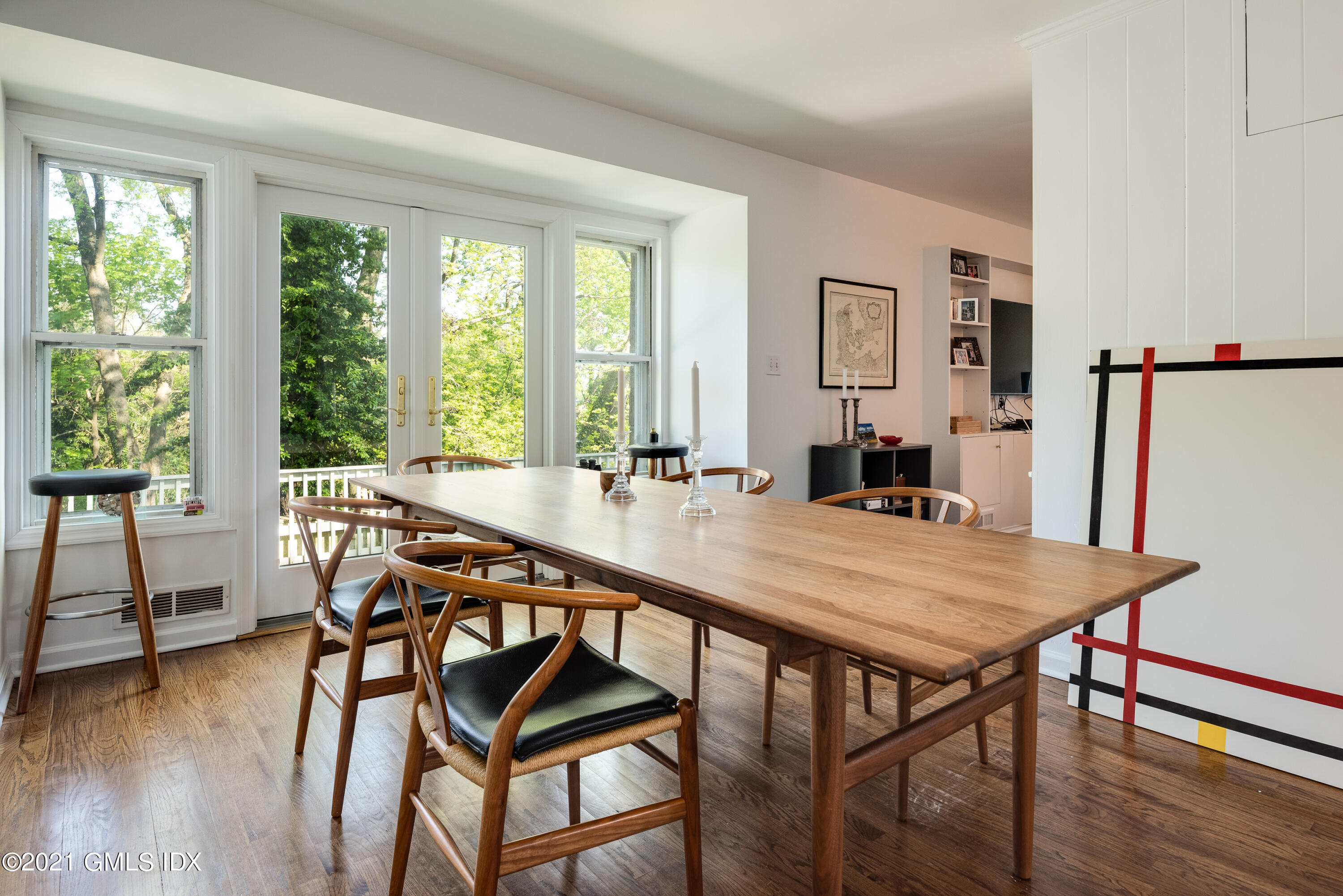 90 Oneida Drive Greenwich, CT 06830 - Photo 13 of 30 a view of a dining room with furniture window and wooden floor