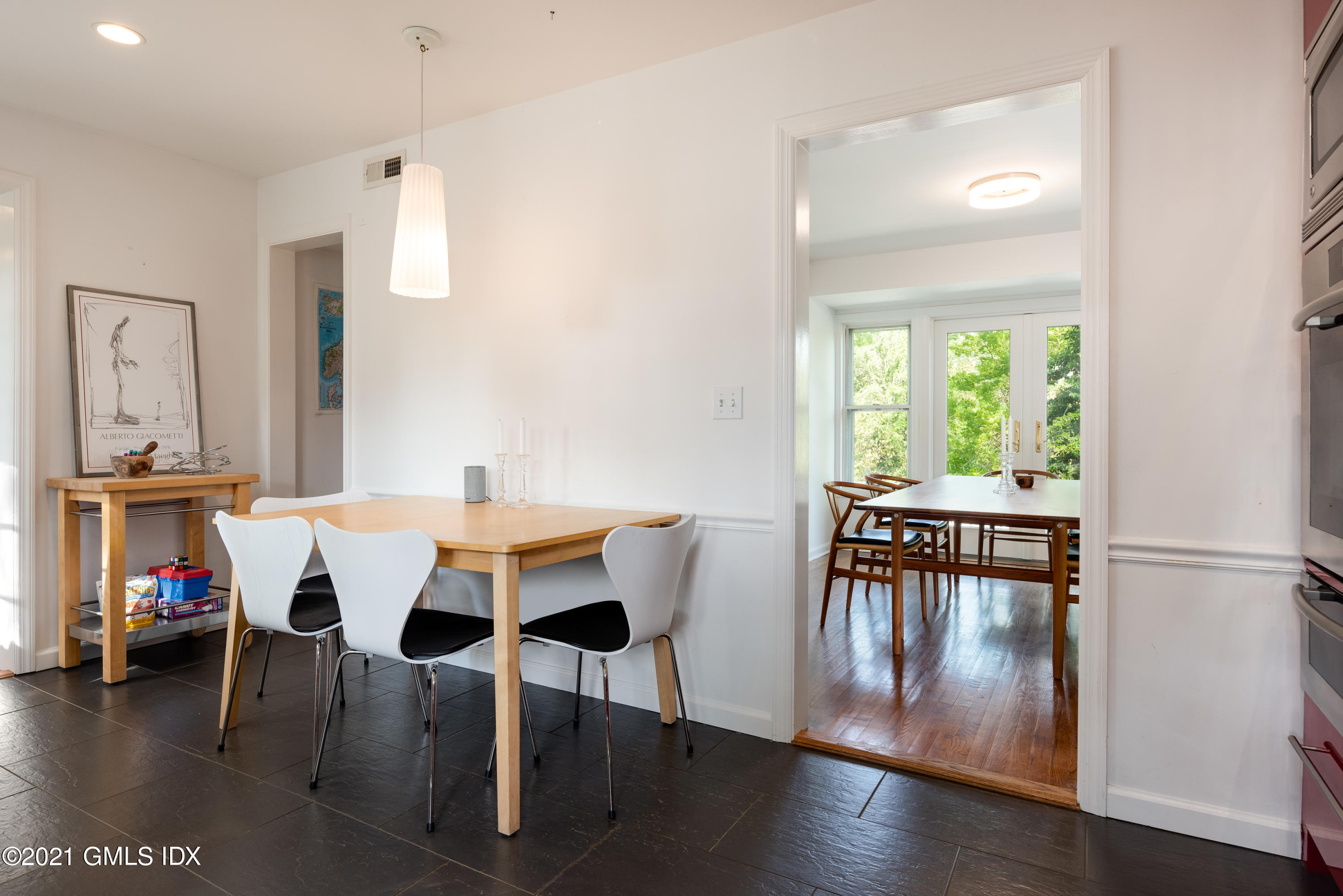 90 Oneida Drive Greenwich, CT 06830 - Photo 14 of 30 a view of a dining room with furniture and wooden floor