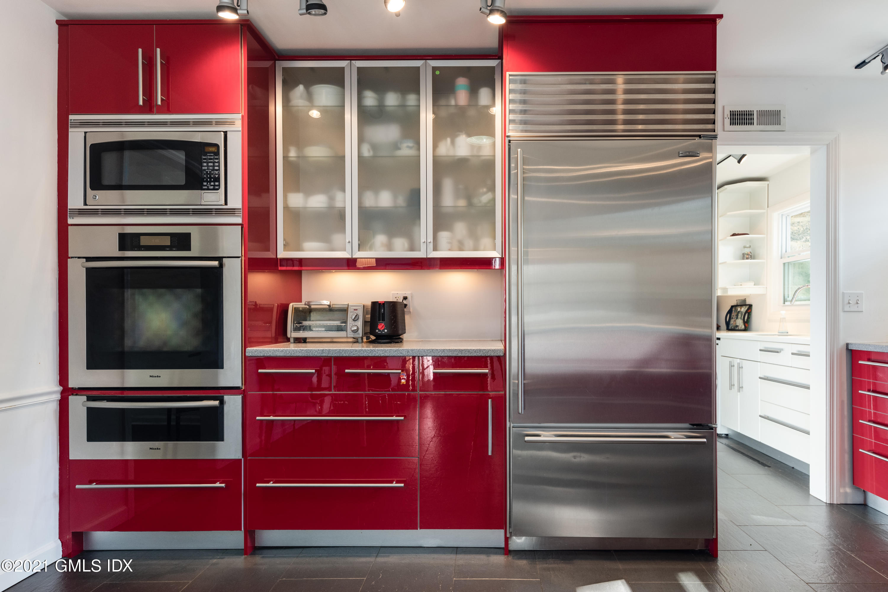 90 Oneida Drive Greenwich, CT 06830 - Photo 16 of 30 a kitchen with stainless steel appliances and cabinets