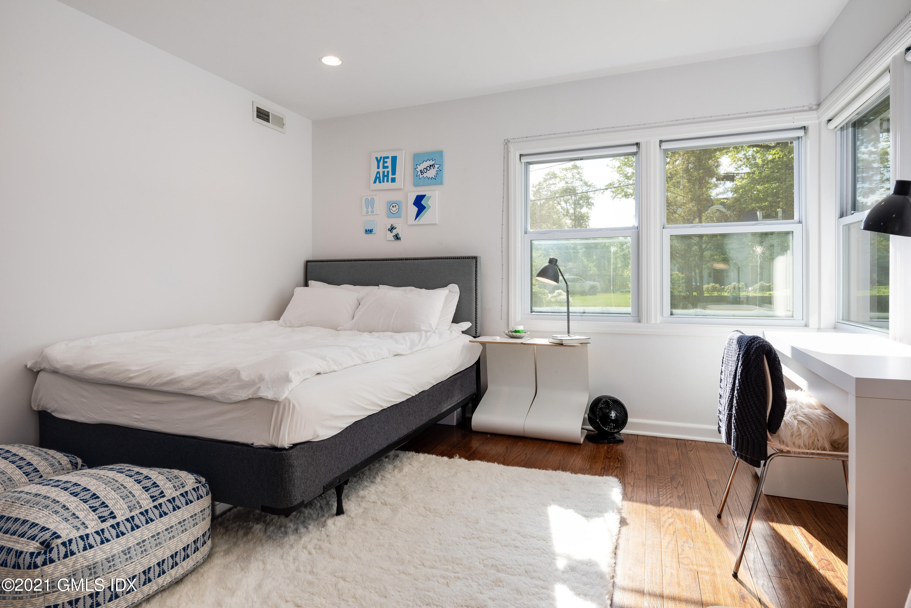 90 Oneida Drive Greenwich, CT 06830 - Photo 22 of 30 a bedroom with a bed and a large window