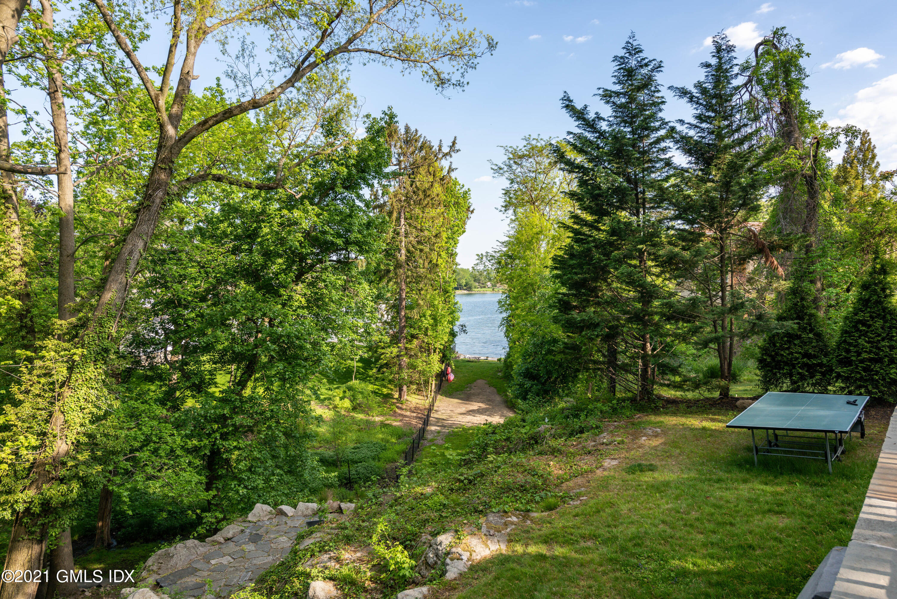 90 Oneida Drive Greenwich, CT 06830 - Photo 25 of 30 a view of a green field with lots of bushes