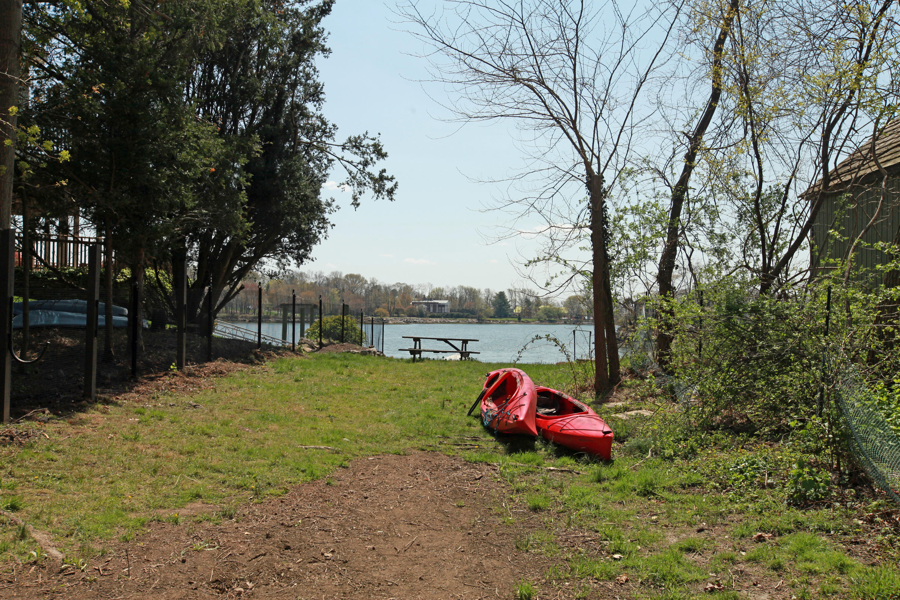 90 Oneida Drive Greenwich, CT 06830 - Photo 3 of 30 a backyard of a house with table and chairs