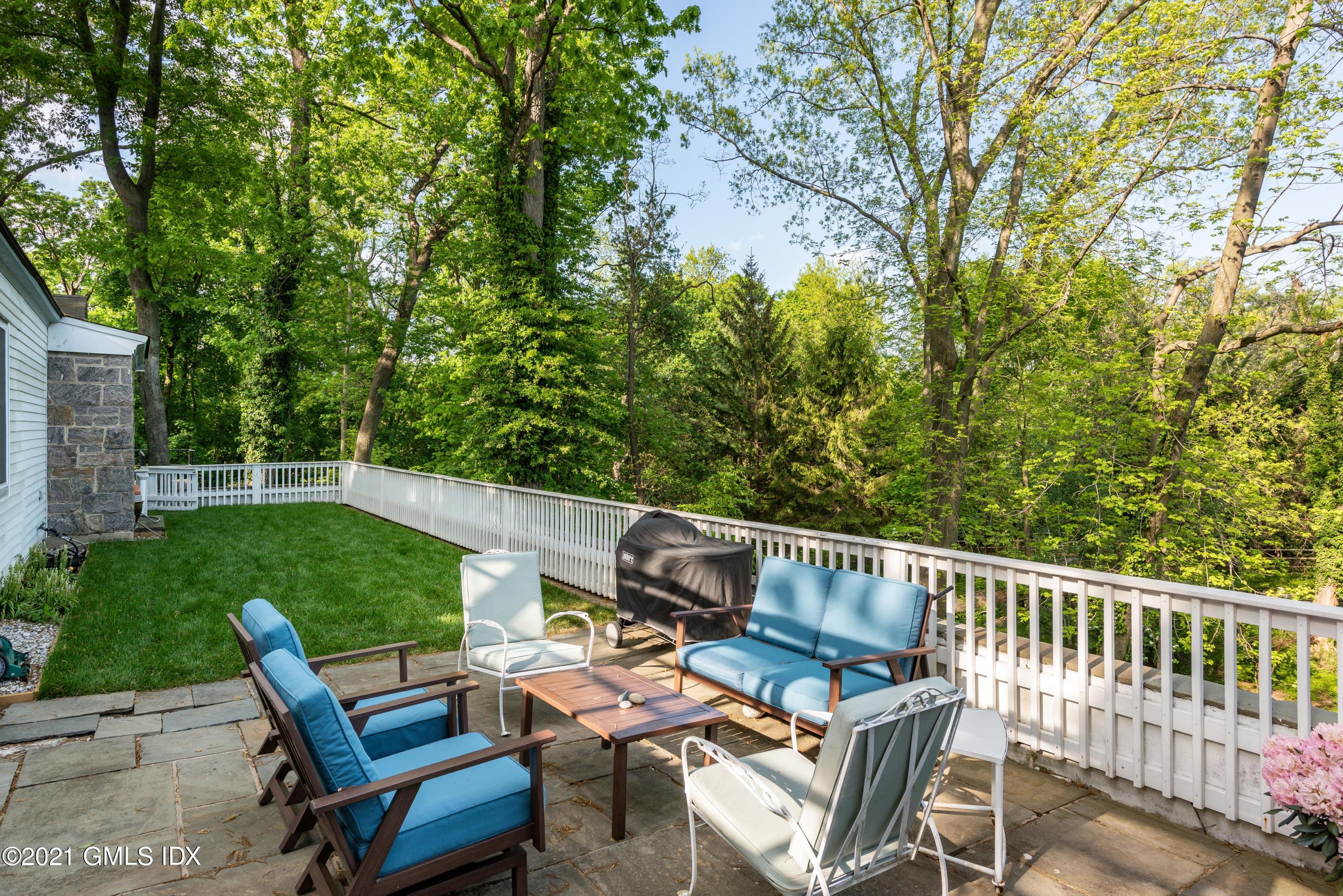 90 Oneida Drive Greenwich, CT 06830 - Photo 8 of 30 a view of a patio with chairs