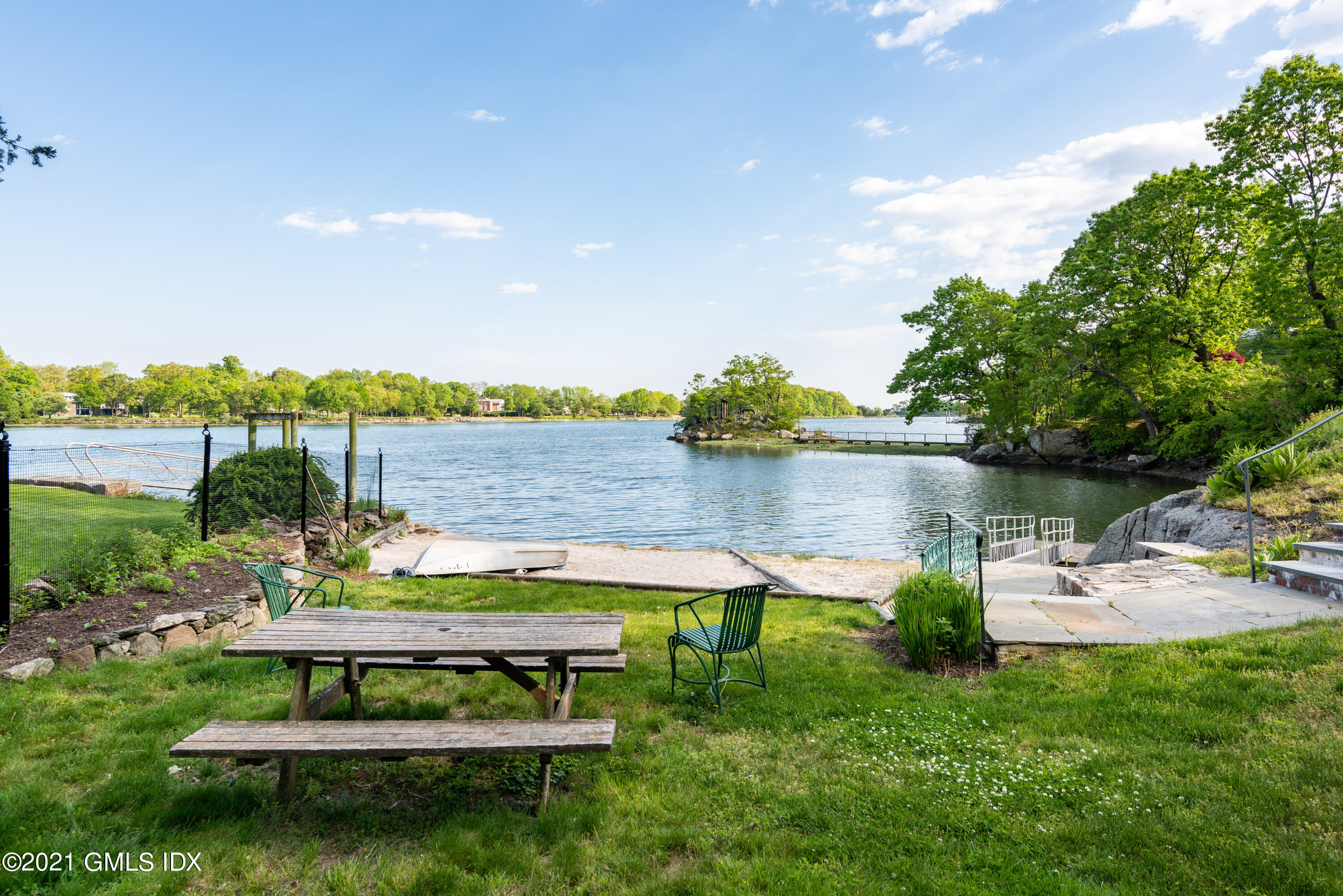90 Oneida Drive Greenwich, CT 06830 - Photo 9 of 30 a park view with a bench and lake view