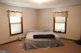 6536 Libertytown Road Berlin, MD 21811 - Photo 7 of 11 a bedroom with a bed and a window