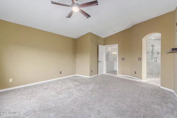 a view of a big room with closet and windows