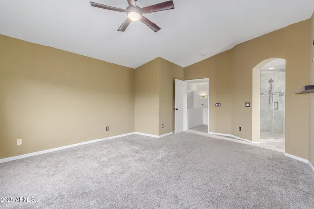 a view of a big room with closet and windows