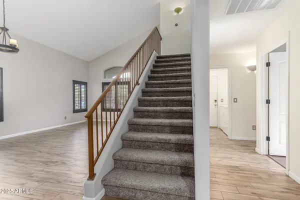 a view of an entryway with wooden floor