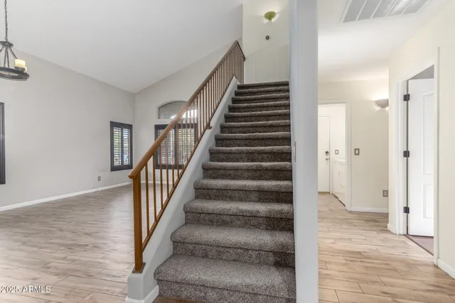 a view of an entryway with wooden floor