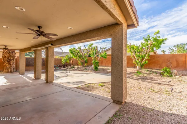 a view of a porch with a floor to ceiling window and wooden floor