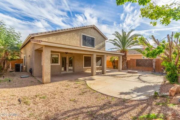 a view of a house with a sink and yard