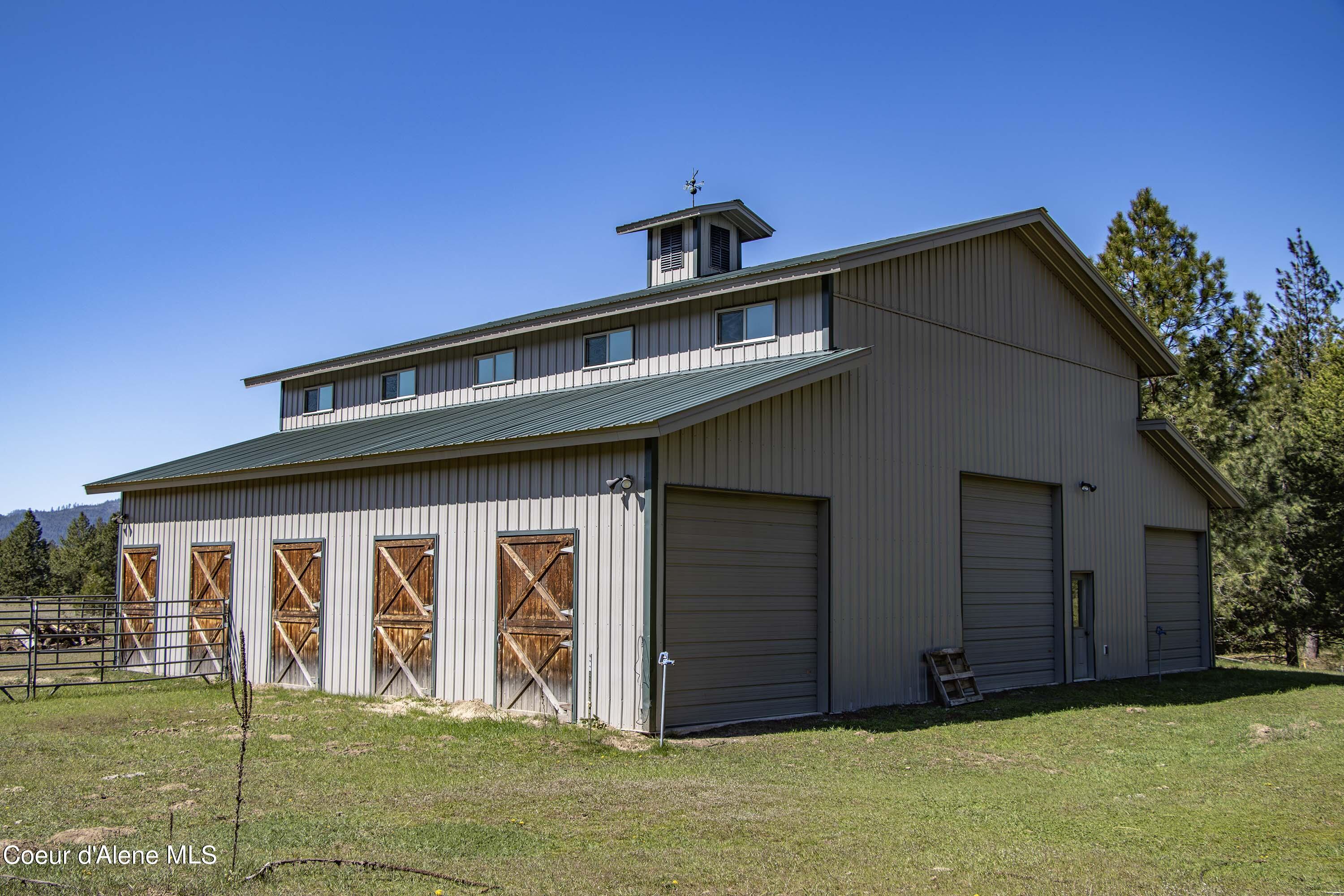877 Heath Lake Road Sagle, ID 83860 - Photo 47 of 60 Barn Drive Through Garage Doors