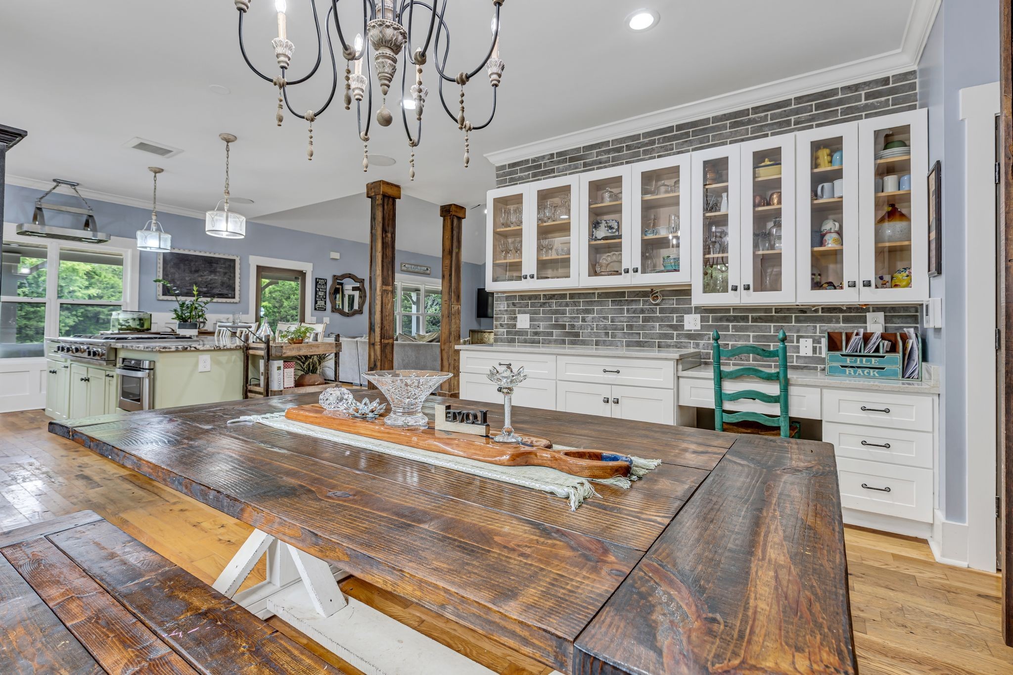 6770 Bly-Trice Road College Grove, TN 37046 - Photo 11 of 58 a view of a kitchen with kitchen island a large window and a sink
