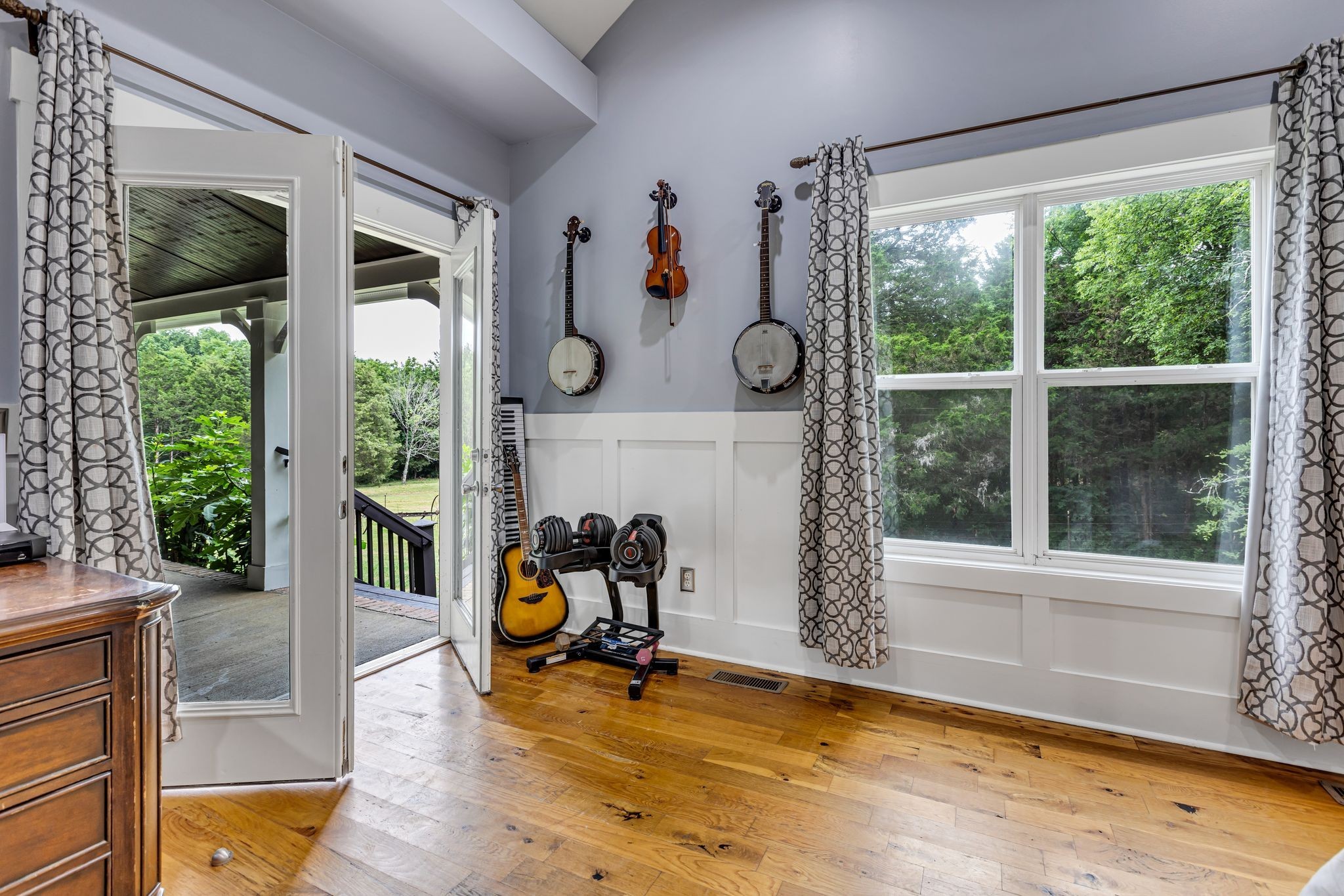 6770 Bly-Trice Road College Grove, TN 37046 - Photo 14 of 58 a view of a room with gym equipment and floor to ceiling windows
