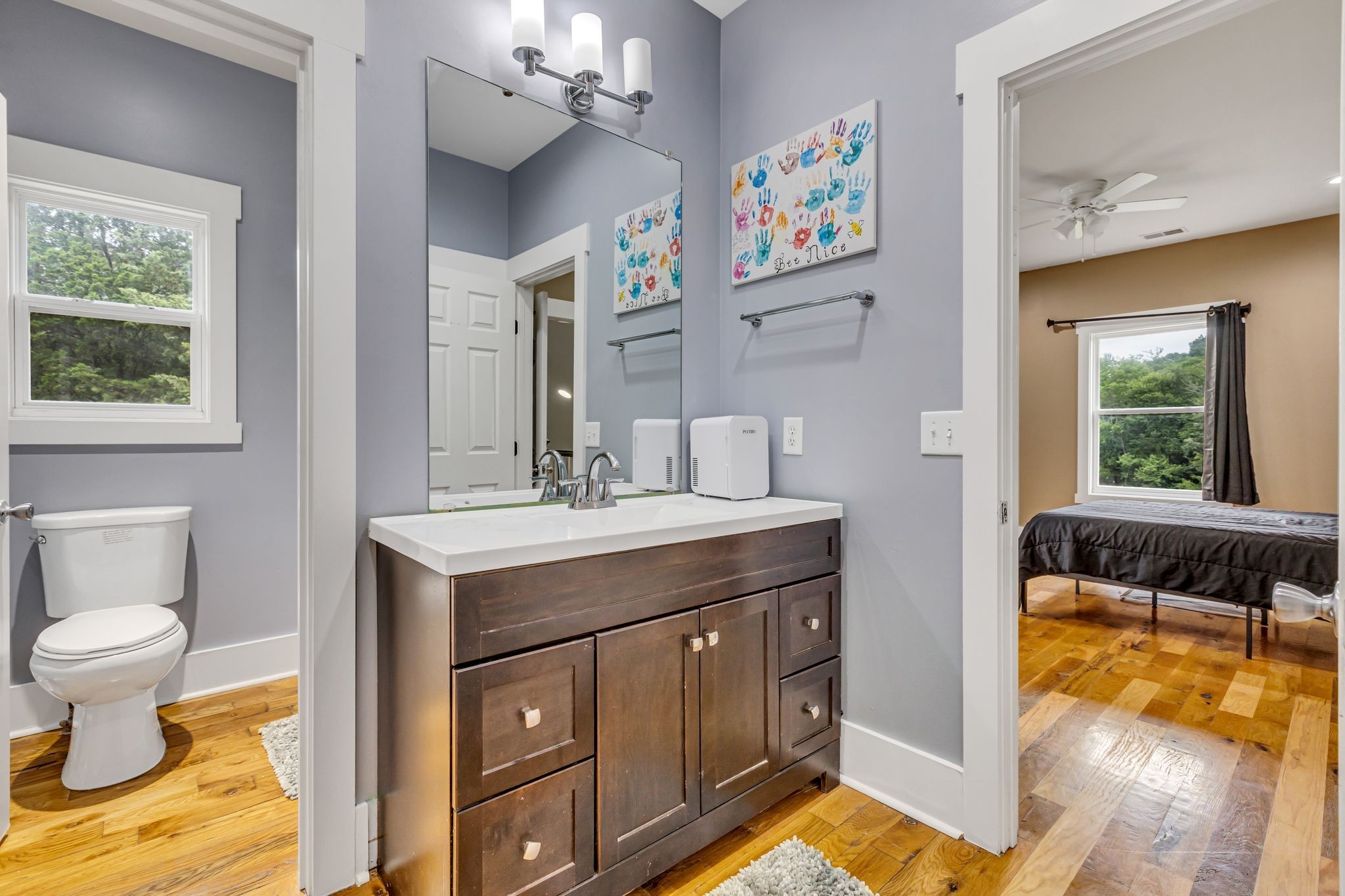 6770 Bly-Trice Road College Grove, TN 37046 - Photo 18 of 58 a bathroom with a sink a toilet and a window