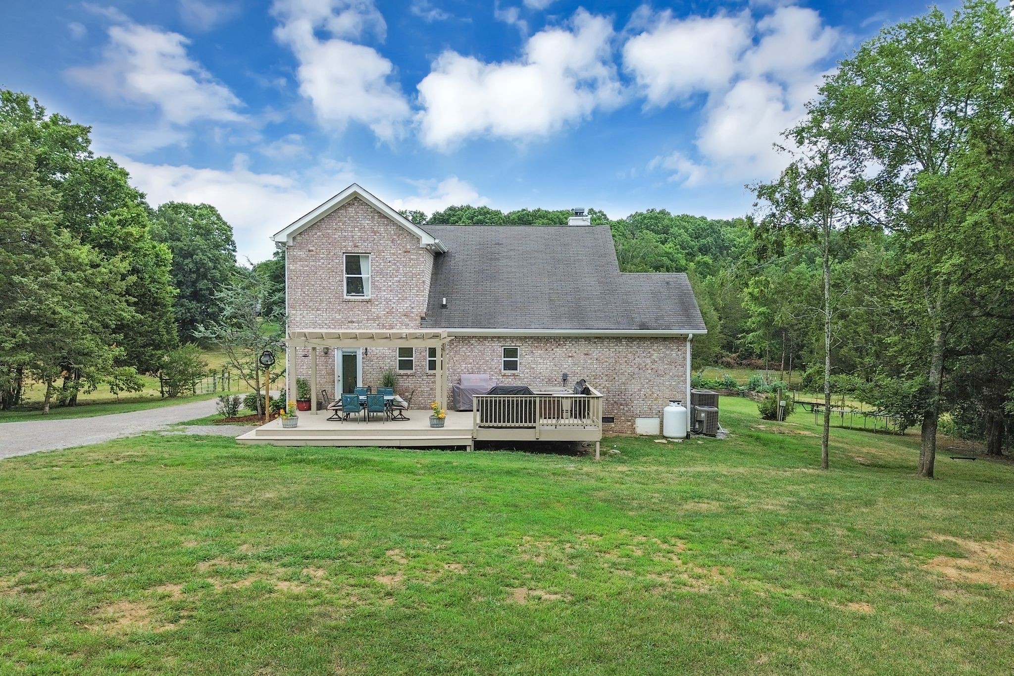 6770 Bly-Trice Road College Grove, TN 37046 - Photo 22 of 58 a front view of house with yard and green space