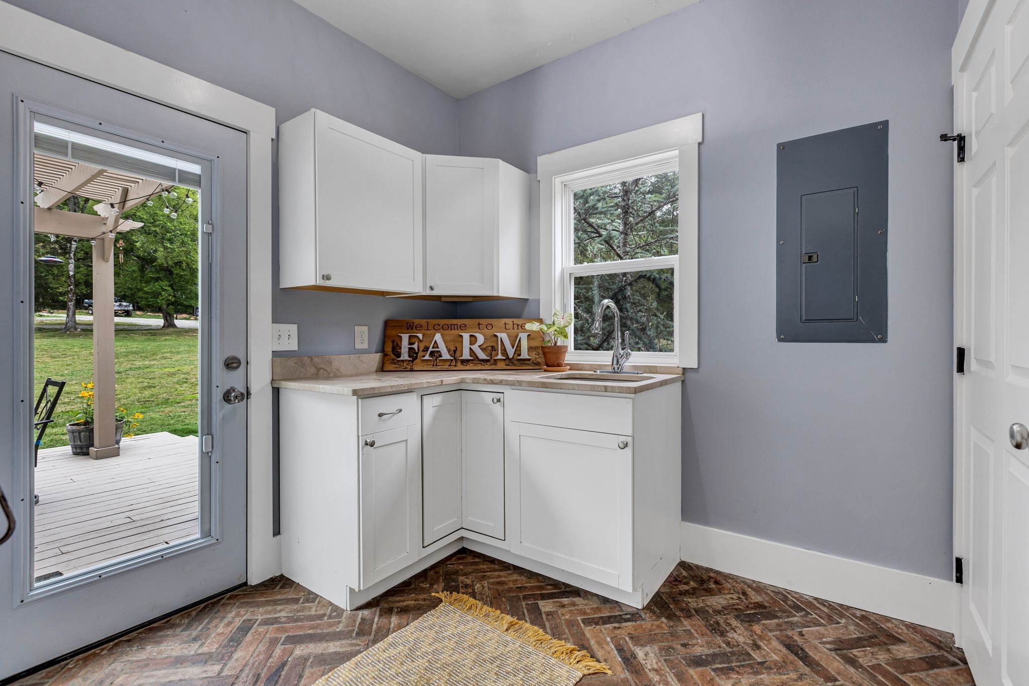 6770 Bly-Trice Road College Grove, TN 37046 - Photo 23 of 58 a kitchen with a stove a refrigerator and a window
