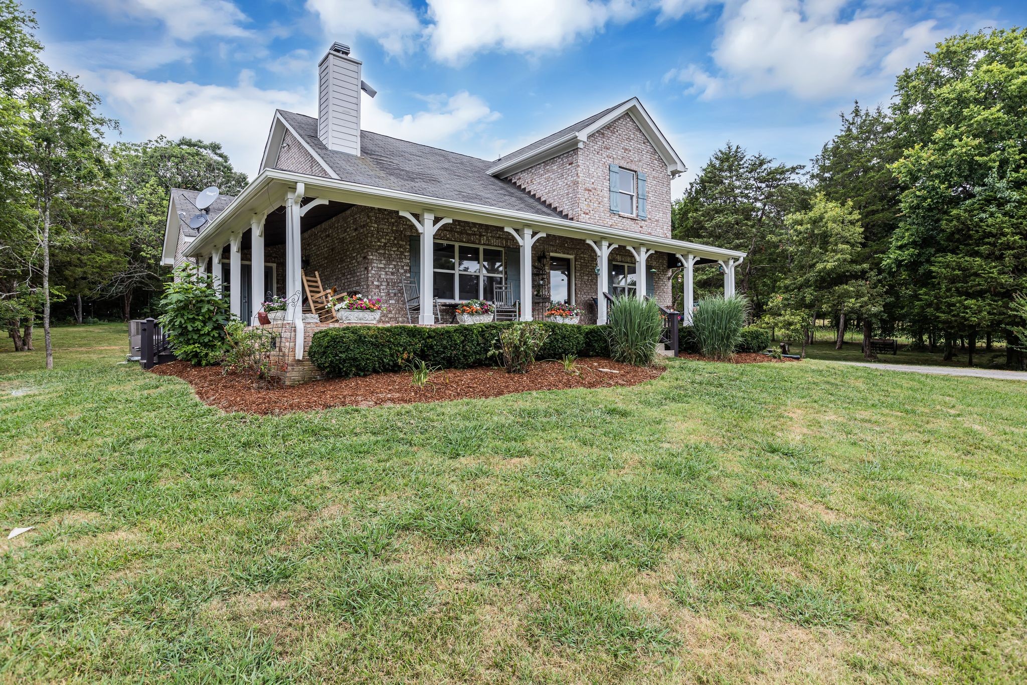 6770 Bly-Trice Road College Grove, TN 37046 - Photo 58 of 58 a front view of a house with garden