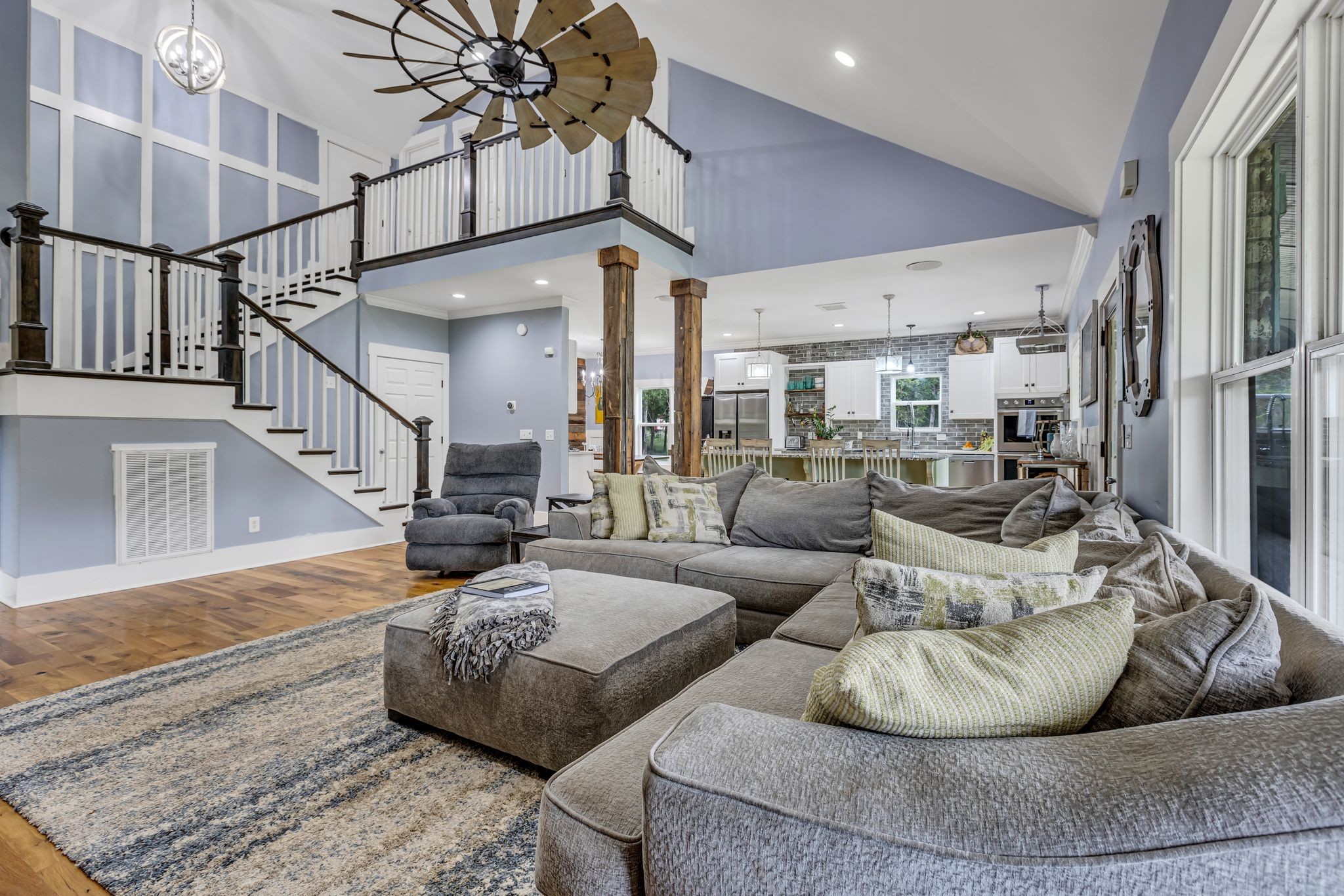 6770 Bly-Trice Road College Grove, TN 37046 - Photo 9 of 58 a living room with furniture ceiling fan and a rug