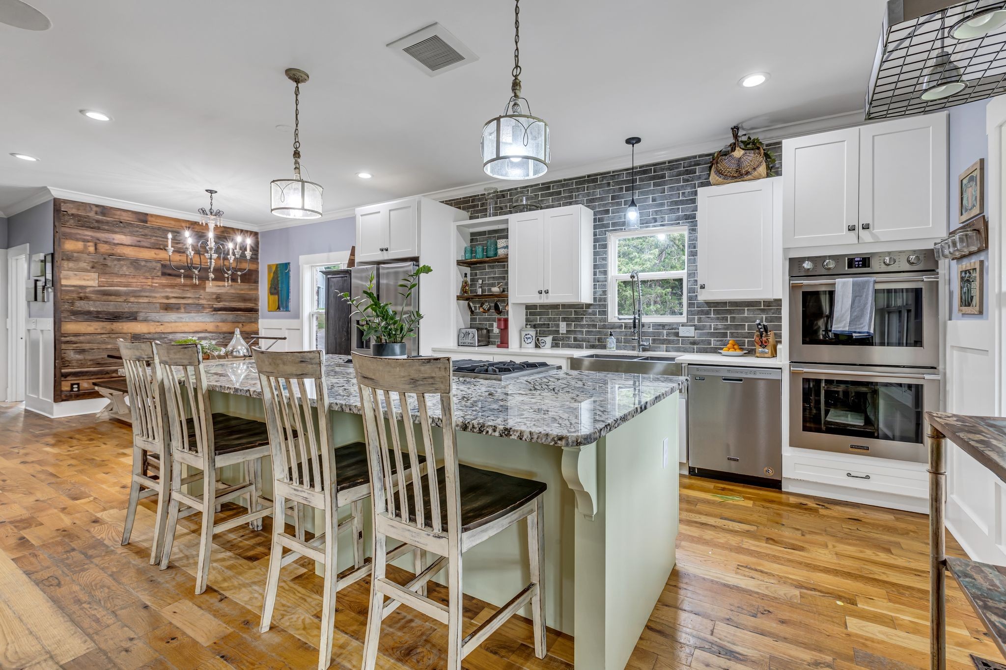 6770 Bly-Trice Road College Grove, TN 37046 - Photo 10 of 58 a kitchen with stainless steel appliances kitchen island granite countertop a stove and cabinets