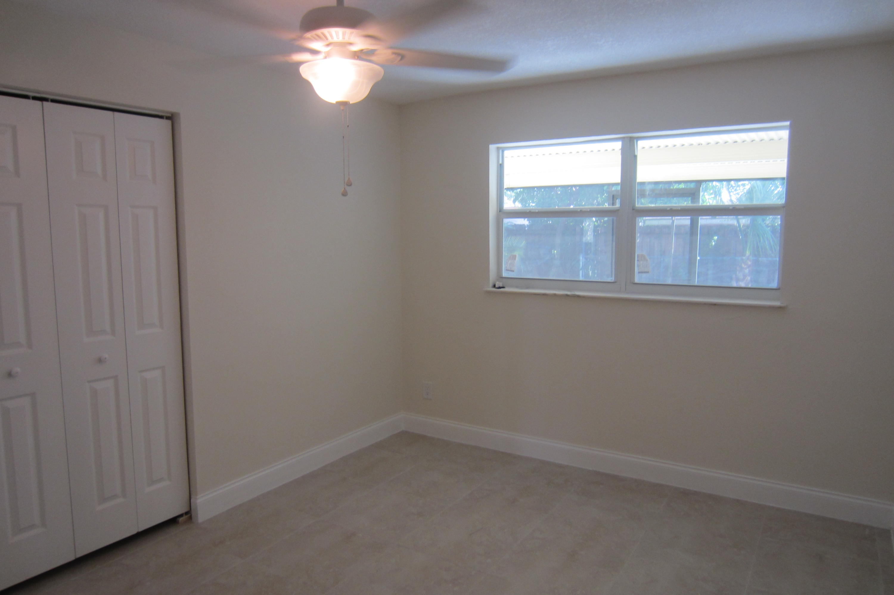 310 Northeast 23rd Way Boca Raton, FL 33431 - Photo 11 of 16 an empty room with a window