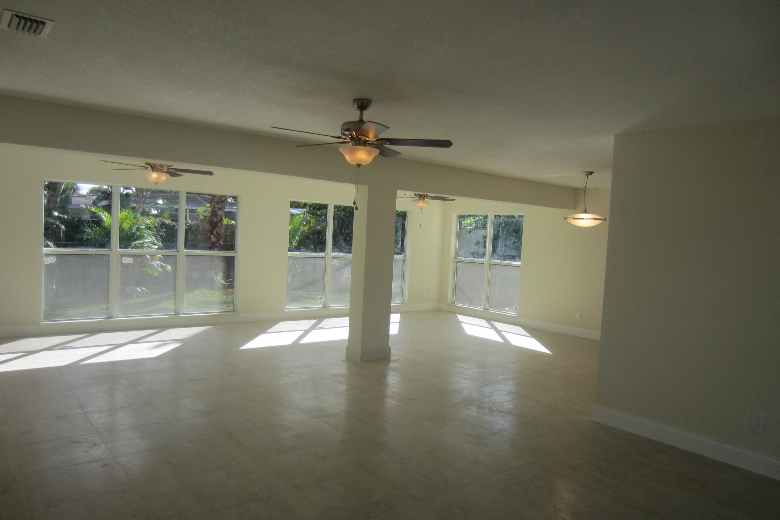 310 Northeast 23rd Way Boca Raton, FL 33431 - Photo 6 of 16 a view of an empty room with a window