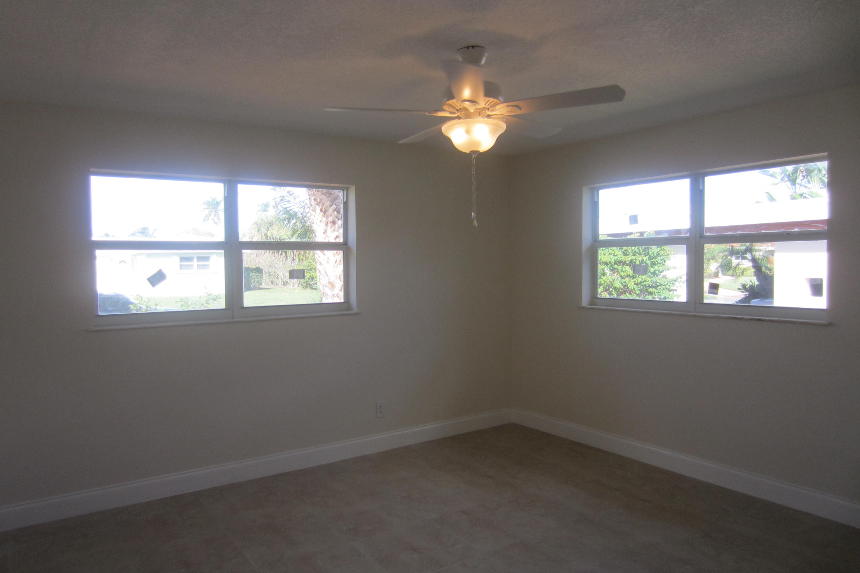 310 Northeast 23rd Way Boca Raton, FL 33431 - Photo 9 of 16 an empty room with a window