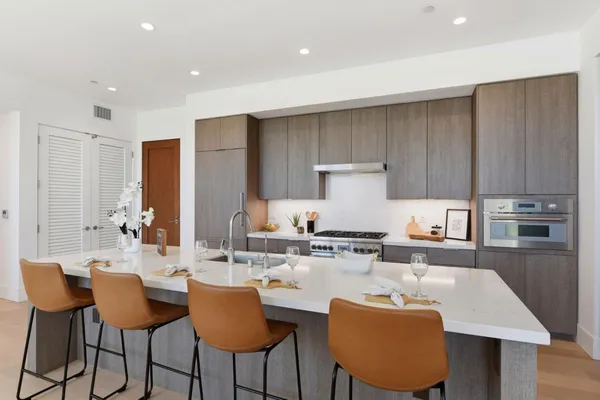 a living room with furniture and a chair