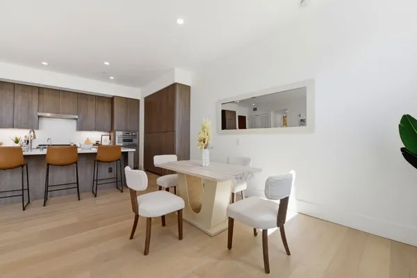 a bed room with a bed and a night stand