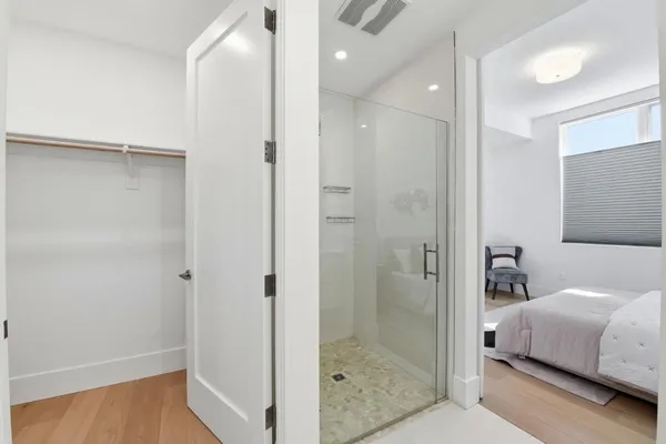 a bathroom with 2 sink tub and a mirror