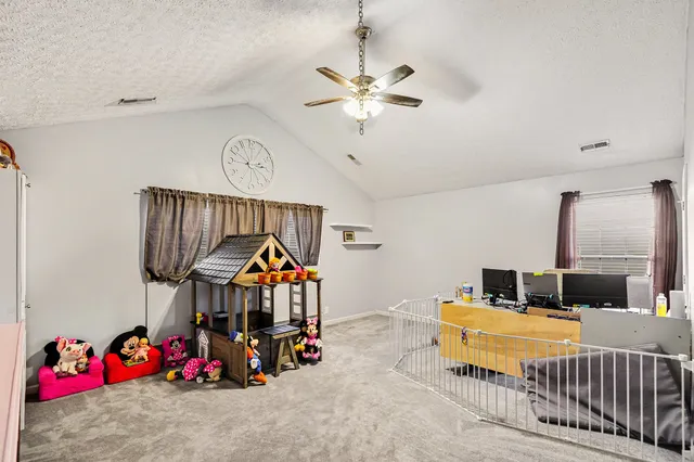 a bedroom with furniture and a bed