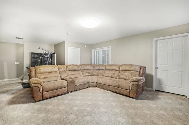 a living room with furniture and a couch