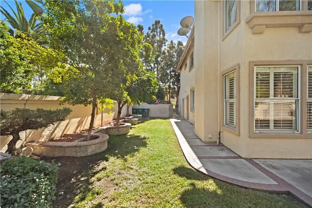 a view of a porch with chairs and floor to ceiling window