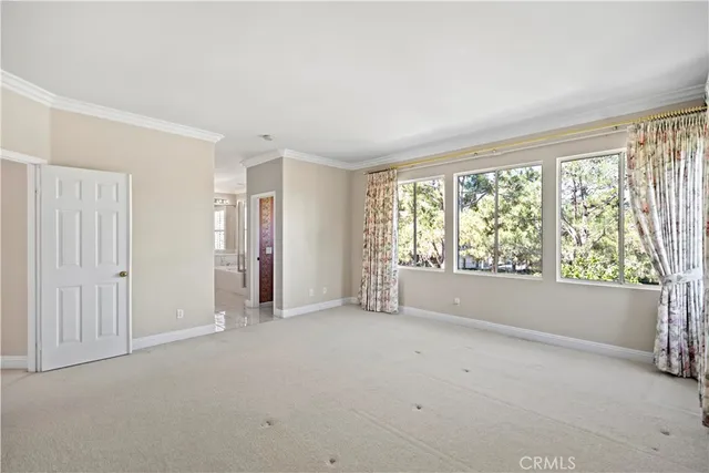 a bathroom with a granite countertop sink a mirror and a bathtub