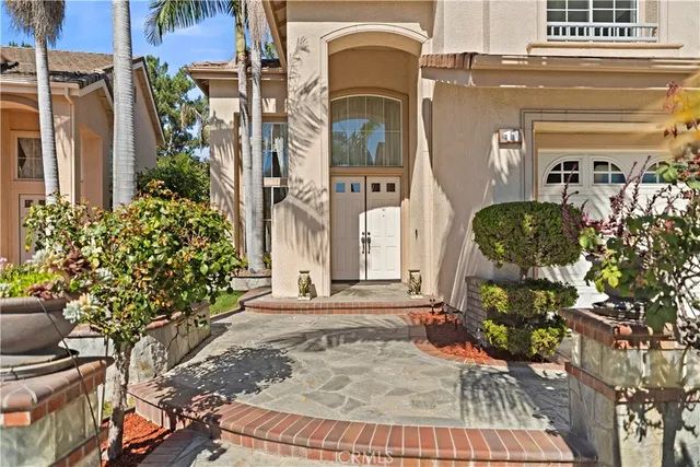 front view of a house with a potted plant