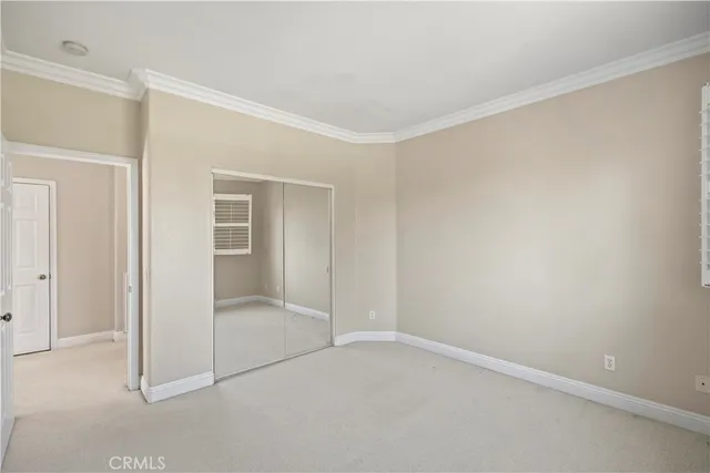 a bathroom with a double vanity sink a mirror and a shower