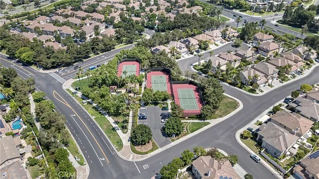 an aerial view of residential houses with outdoor space