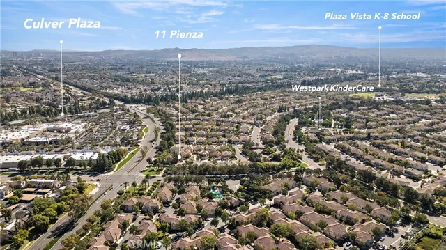 an aerial view of a city with lots of residential buildings