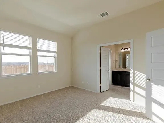 a kitchen with kitchen island a sink stainless steel appliances and window