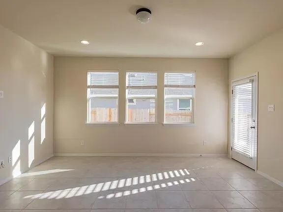 a large kitchen with stainless steel appliances kitchen island granite countertop a large counter top and stainless steel appliances