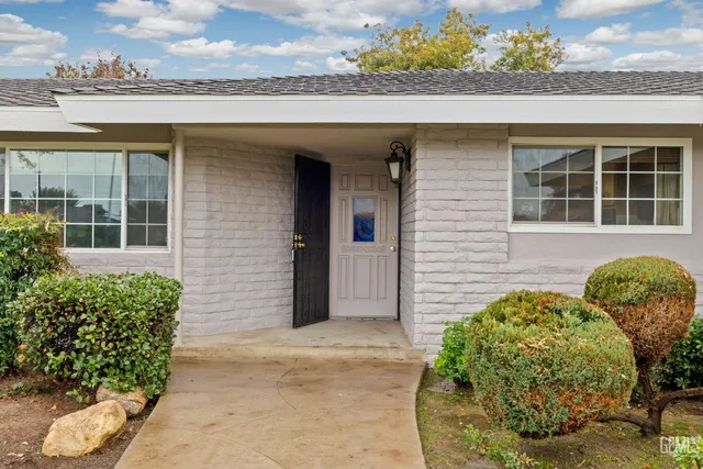 front view of a house with a potted plant