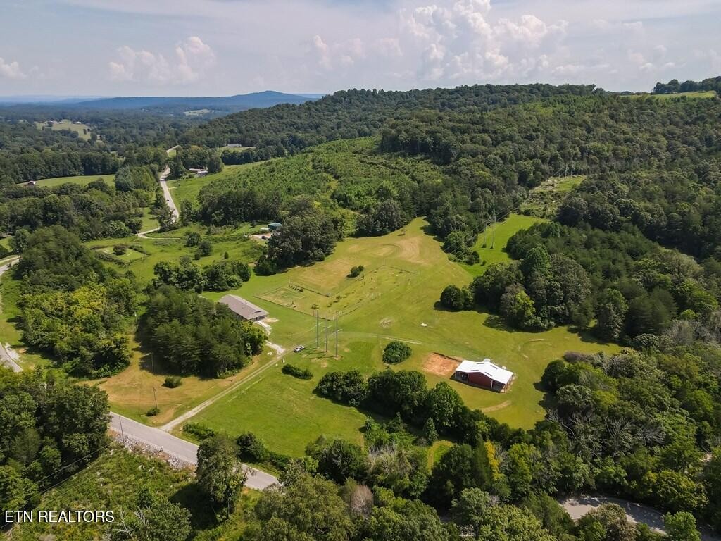 1518 Cummingsville And Sparkman Road Doyle, TN 38559 - Photo 3 of 58 an aerial view of a house with a yard