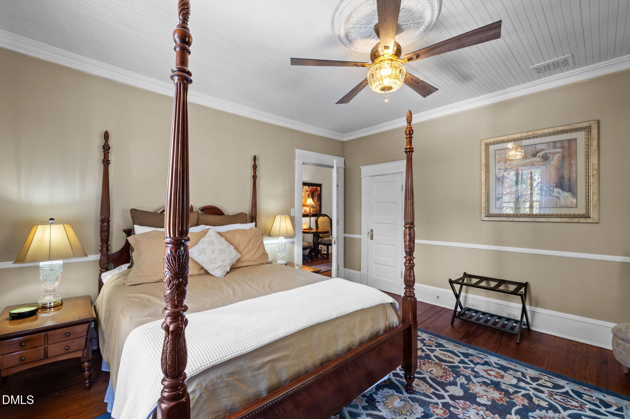 7891 Boston Road Roxboro, NC 27574 - Photo 40 of 85 a bed room with a bed and a chandelier